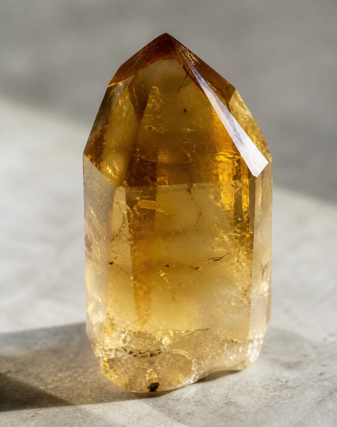 Golden citrine crystal showing internal color as a trace chemistry effect rather than surface pigment